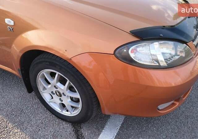 Оранжевый Шевроле Лачетти, объемом двигателя 2 л и пробегом 272 тыс. км за 3400 $, фото 9 на Automoto.ua