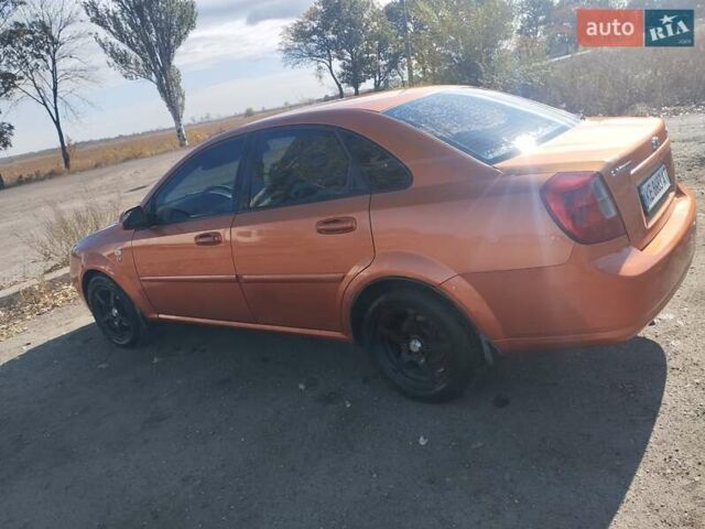 Помаранчевий Шевроле Лачетті, об'ємом двигуна 1.8 л та пробігом 207 тис. км за 4400 $, фото 7 на Automoto.ua