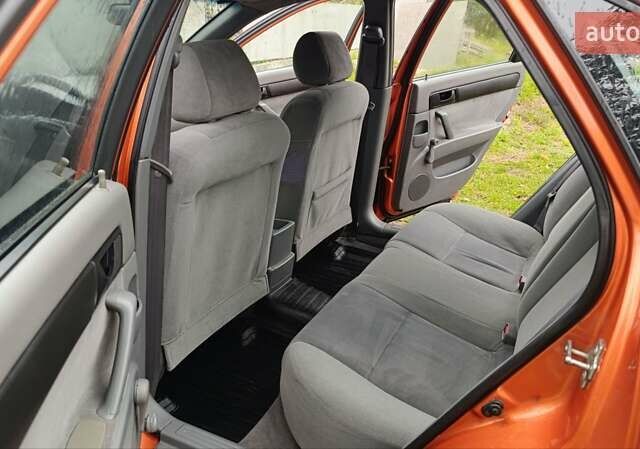 Оранжевый Шевроле Лачетти, объемом двигателя 1.6 л и пробегом 267 тыс. км за 3600 $, фото 2 на Automoto.ua