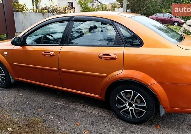 Оранжевый Шевроле Лачетти, объемом двигателя 1.6 л и пробегом 267 тыс. км за 3600 $, фото 10 на Automoto.ua
