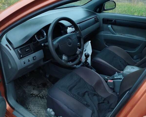 Оранжевый Шевроле Лачетти, объемом двигателя 1.6 л и пробегом 335 тыс. км за 4300 $, фото 17 на Automoto.ua