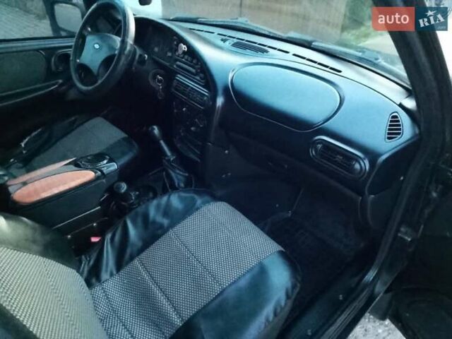 Черный Шевроле Нива, объемом двигателя 1.69 л и пробегом 180 тыс. км за 3300 $, фото 9 на Automoto.ua