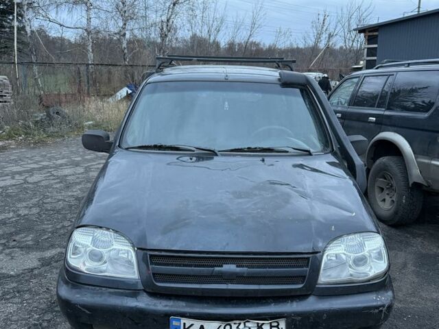 Черный Шевроле Нива, объемом двигателя 1.7 л и пробегом 200 тыс. км за 1307 $, фото 1 на Automoto.ua