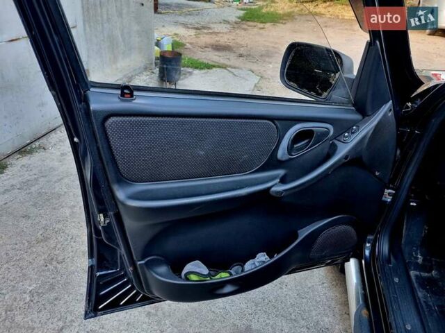 Черный Шевроле Нива, объемом двигателя 1.7 л и пробегом 282 тыс. км за 3999 $, фото 7 на Automoto.ua