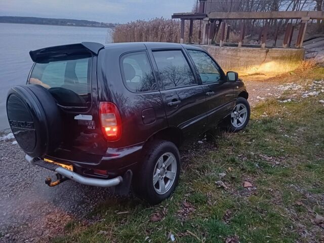 Черный Шевроле Нива, объемом двигателя 1 л и пробегом 234 тыс. км за 3300 $, фото 5 на Automoto.ua