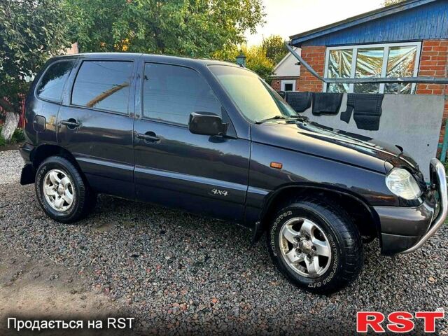 Черный Шевроле Нива, объемом двигателя 1.7 л и пробегом 194 тыс. км за 4100 $, фото 1 на Automoto.ua