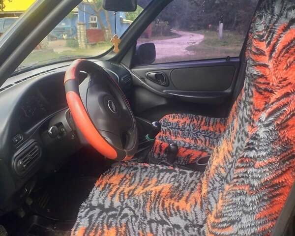 Черный Шевроле Нива, объемом двигателя 1.69 л и пробегом 148 тыс. км за 4950 $, фото 2 на Automoto.ua