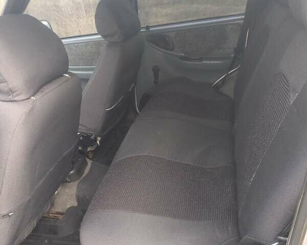 Серый Шевроле Нива, объемом двигателя 1.8 л и пробегом 205 тыс. км за 2841 $, фото 3 на Automoto.ua