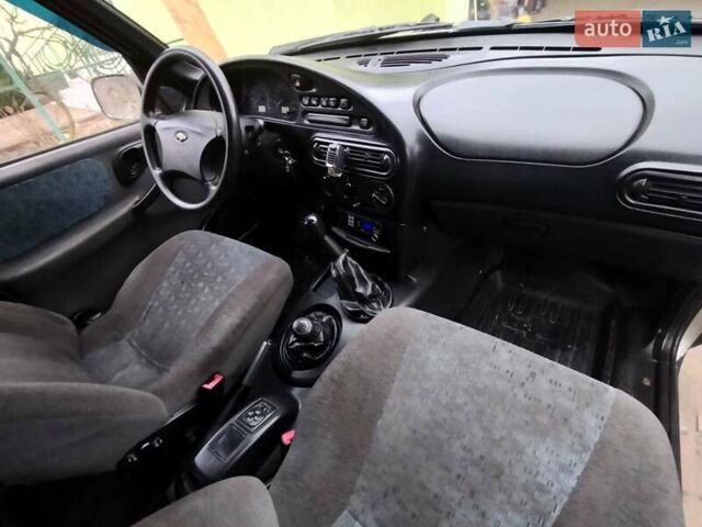 Серый Шевроле Нива, объемом двигателя 1.7 л и пробегом 147 тыс. км за 3200 $, фото 3 на Automoto.ua