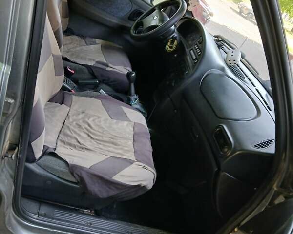 Серый Шевроле Нива, объемом двигателя 1.69 л и пробегом 148 тыс. км за 3500 $, фото 11 на Automoto.ua