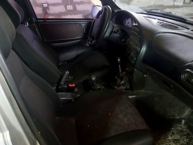 Серый Шевроле Нива, объемом двигателя 1.7 л и пробегом 230 тыс. км за 2600 $, фото 5 на Automoto.ua