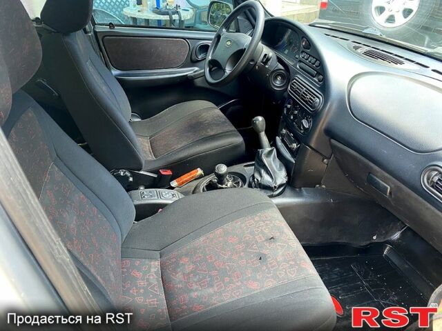 Серый Шевроле Нива, объемом двигателя 1.7 л и пробегом 200 тыс. км за 3350 $, фото 5 на Automoto.ua