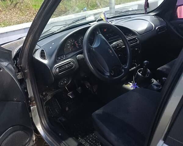 Серый Шевроле Нива, объемом двигателя 1.7 л и пробегом 213 тыс. км за 3500 $, фото 12 на Automoto.ua