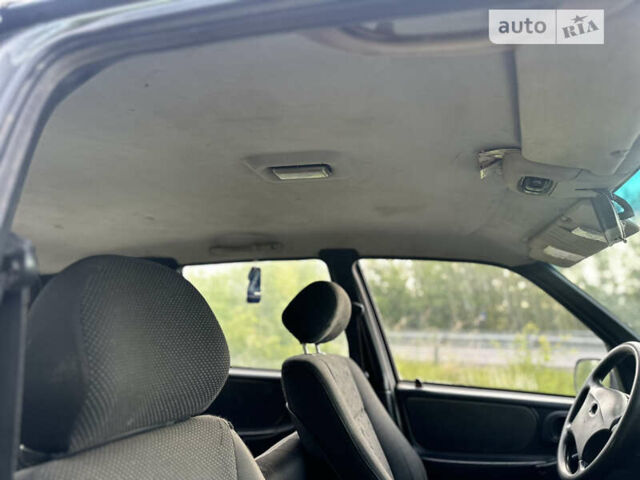 Серый Шевроле Нива, объемом двигателя 1.69 л и пробегом 195 тыс. км за 2400 $, фото 20 на Automoto.ua