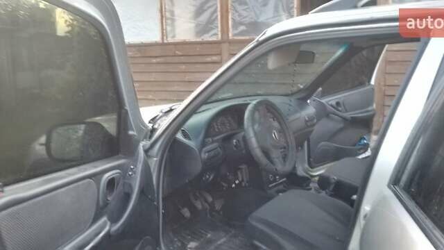 Серый Шевроле Нива, объемом двигателя 1.69 л и пробегом 155 тыс. км за 5200 $, фото 9 на Automoto.ua