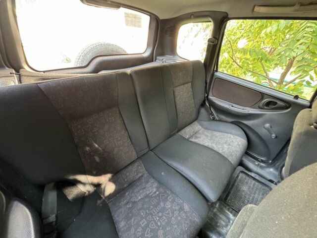 Синий Шевроле Нива, объемом двигателя 1.7 л и пробегом 230 тыс. км за 1850 $, фото 5 на Automoto.ua