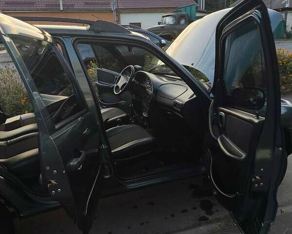 Зеленый Шевроле Нива, объемом двигателя 1.69 л и пробегом 88 тыс. км за 5800 $, фото 4 на Automoto.ua