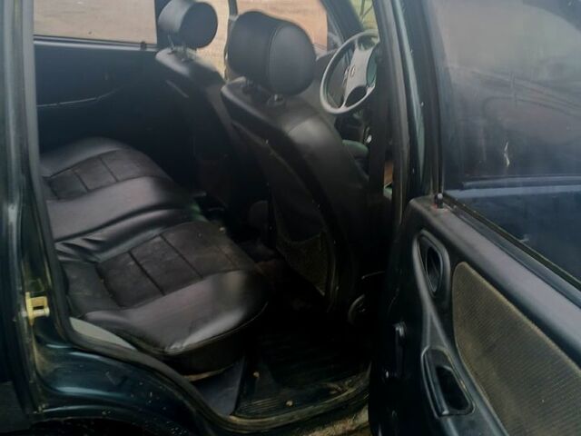 Зеленый Шевроле Нива, объемом двигателя 1.7 л и пробегом 227 тыс. км за 3000 $, фото 4 на Automoto.ua