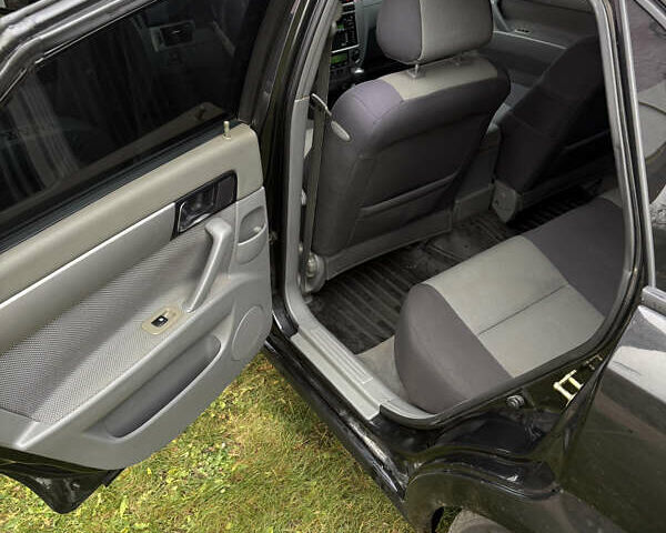 Черный Шевроле Нубира, объемом двигателя 1.8 л и пробегом 221 тыс. км за 4700 $, фото 15 на Automoto.ua