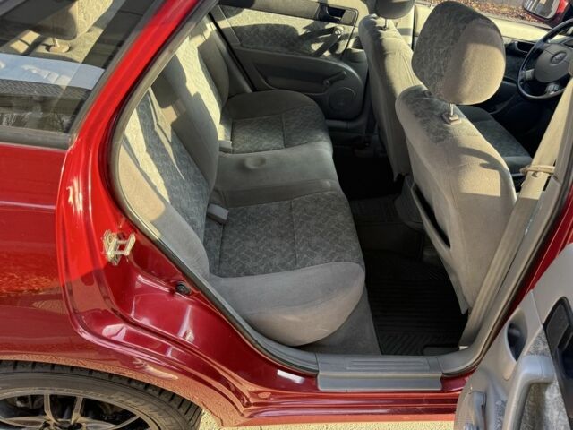 Красный Шевроле Нубира, объемом двигателя 1.8 л и пробегом 231 тыс. км за 3500 $, фото 18 на Automoto.ua