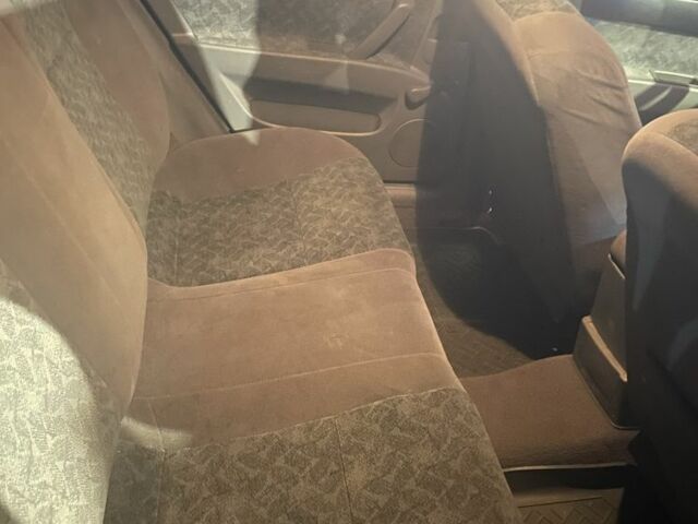 Красный Шевроле Нубира, объемом двигателя 1.8 л и пробегом 250 тыс. км за 3099 $, фото 12 на Automoto.ua