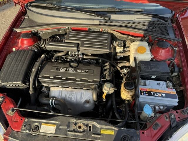 Красный Шевроле Нубира, объемом двигателя 1.8 л и пробегом 231 тыс. км за 3500 $, фото 23 на Automoto.ua