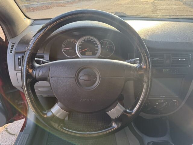 Красный Шевроле Нубира, объемом двигателя 1.8 л и пробегом 231 тыс. км за 3500 $, фото 14 на Automoto.ua