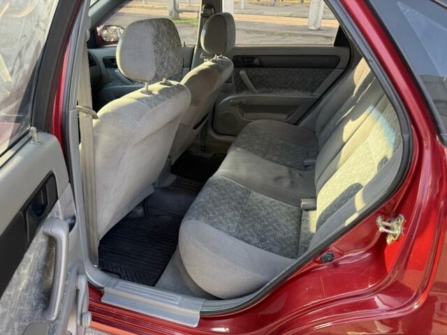 Красный Шевроле Нубира, объемом двигателя 1.8 л и пробегом 231 тыс. км за 3500 $, фото 20 на Automoto.ua