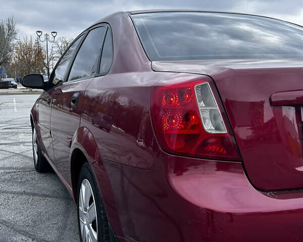 Красный Шевроле Нубира, объемом двигателя 1.6 л и пробегом 222 тыс. км за 3999 $, фото 7 на Automoto.ua