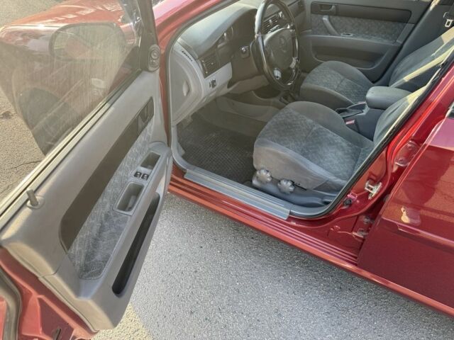 Красный Шевроле Нубира, объемом двигателя 1.8 л и пробегом 231 тыс. км за 3500 $, фото 10 на Automoto.ua