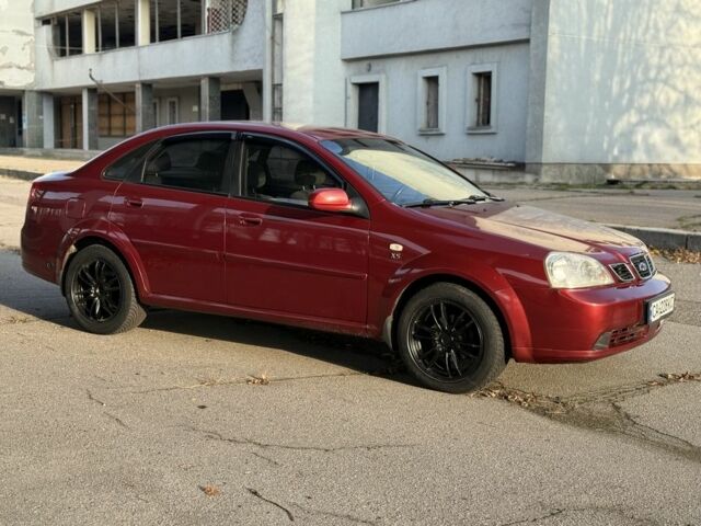 Красный Шевроле Нубира, объемом двигателя 1.8 л и пробегом 231 тыс. км за 3500 $, фото 2 на Automoto.ua