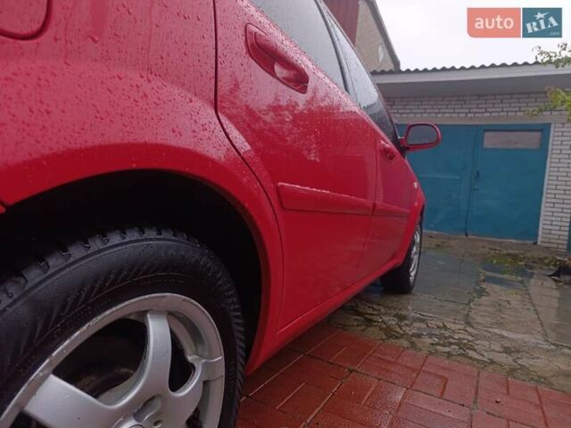 Красный Шевроле Нубира, объемом двигателя 1.6 л и пробегом 235 тыс. км за 3900 $, фото 18 на Automoto.ua