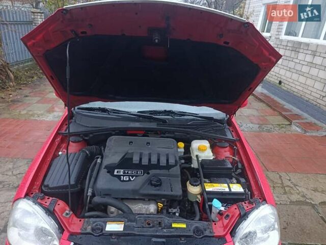 Красный Шевроле Нубира, объемом двигателя 1.6 л и пробегом 235 тыс. км за 3900 $, фото 23 на Automoto.ua