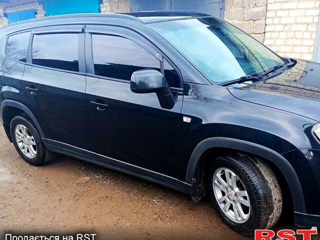 Черный Шевроле Орландо, объемом двигателя 1.8 л и пробегом 269 тыс. км за 8555 $, фото 1 на Automoto.ua