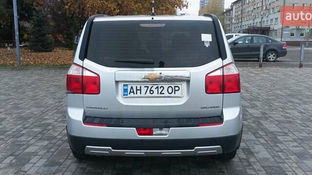 Серый Шевроле Орландо, объемом двигателя 1.8 л и пробегом 115 тыс. км за 8500 $, фото 1 на Automoto.ua