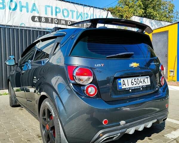 Серый Шевроле Соник, объемом двигателя 1.8 л и пробегом 220 тыс. км за 9000 $, фото 13 на Automoto.ua