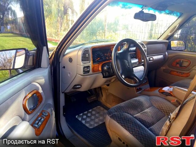 Синий Шевроле Тахо, объемом двигателя 5.7 л и пробегом 260 тыс. км за 13000 $, фото 5 на Automoto.ua