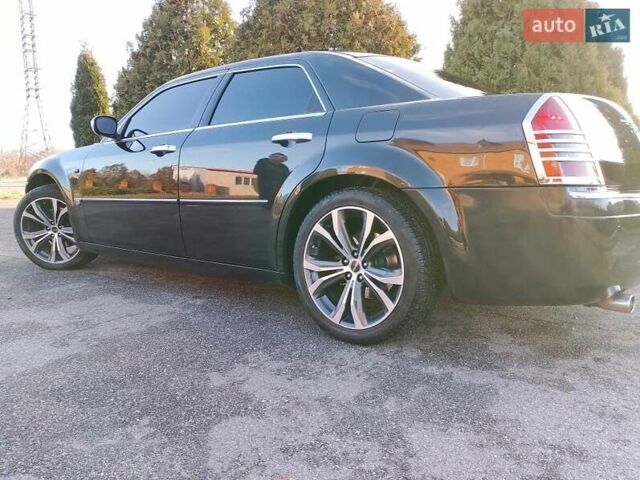 Черный Крайслер 300C, объемом двигателя 3.5 л и пробегом 202 тыс. км за 7593 $, фото 1 на Automoto.ua
