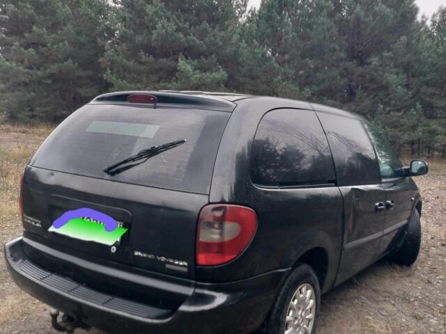 Черный Крайслер Гранд Вояджер, объемом двигателя 2.5 л и пробегом 276 тыс. км за 1593 $, фото 1 на Automoto.ua