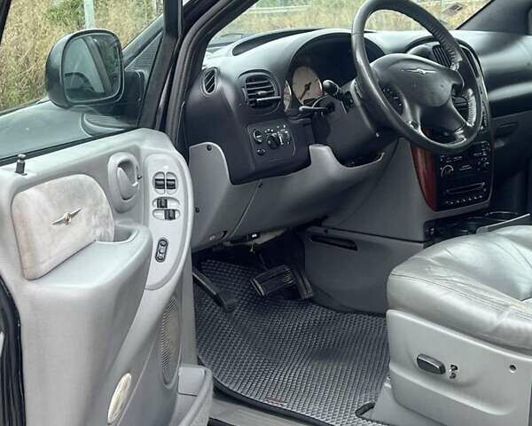 Крайслер Гранд Вояджер 2005 в Могилев-Подольском на Automoto.ua Черный Крайслер Гранд Вояджер, объемом двигателя 2.8 л и пробегом 280 тыс. км за 5900 $, фото 4 на Automoto.ua