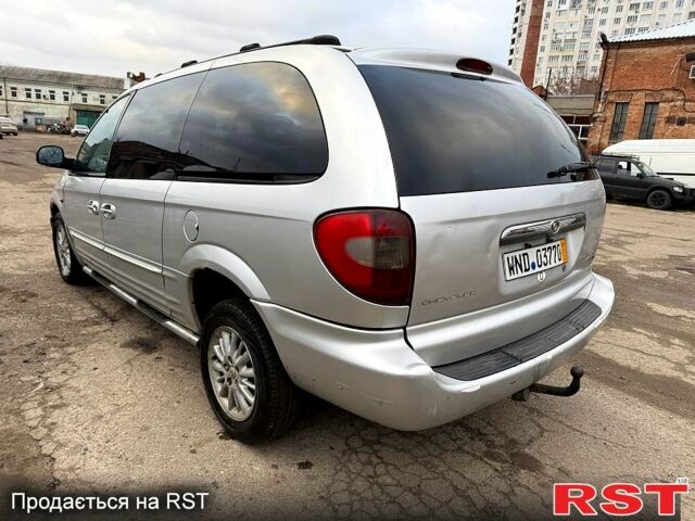 Серый Крайслер Гранд Вояджер, объемом двигателя 2.5 л и пробегом 289 тыс. км за 2500 $, фото 2 на Automoto.ua