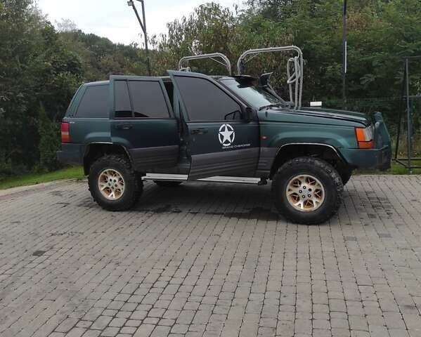 Зеленый Крайслер Джип Чероки, объемом двигателя 2.5 л и пробегом 200 тыс. км за 4500 $, фото 12 на Automoto.ua