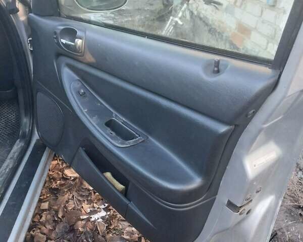 Крайслер Себрінг 2003 у Голованевске на Automoto.ua Сірий Крайслер Себрінг, об'ємом двигуна 2 л та пробігом 175 тис. км за 2399 $, фото 13 на Automoto.ua