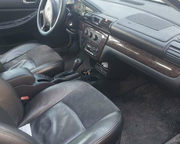 Крайслер Себрінг 2003 у Голованевске на Automoto.ua Сірий Крайслер Себрінг, об'ємом двигуна 2 л та пробігом 175 тис. км за 2399 $, фото 14 на Automoto.ua