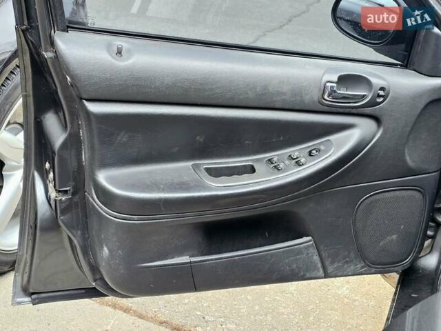 Сірий Крайслер Себрінг, об'ємом двигуна 2 л та пробігом 200 тис. км за 2500 $, фото 9 на Automoto.ua