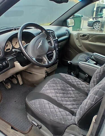 Крайслер Вояджер 2003 в Николаеве на Automoto.ua Серый Крайслер Вояджер, объемом двигателя 2.5 л и пробегом 380 тыс. км за 5200 $, фото 9 на Automoto.ua