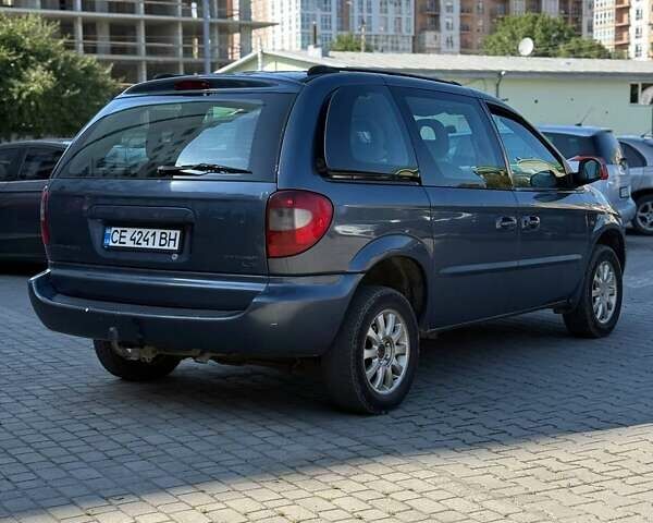 Сірий Крайслер Voyager, об'ємом двигуна 2.5 л та пробігом 446 тис. км за 5000 $, фото 6 на Automoto.ua