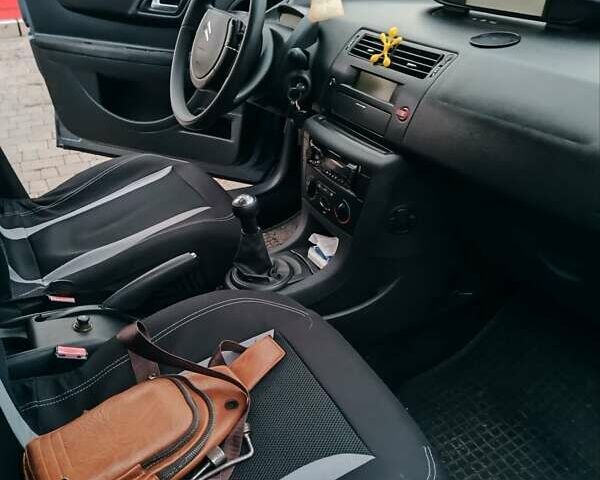 Синий Ситроен С4, объемом двигателя 1.4 л и пробегом 195 тыс. км за 3400 $, фото 5 на Automoto.ua