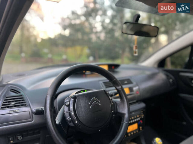 Синій Сітроен С4, об'ємом двигуна 1.59 л та пробігом 242 тис. км за 2399 $, фото 12 на Automoto.ua