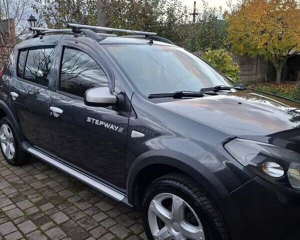 Серый Дачия Сандеро, объемом двигателя 1.6 л и пробегом 200 тыс. км за 6400 $, фото 1 на Automoto.ua